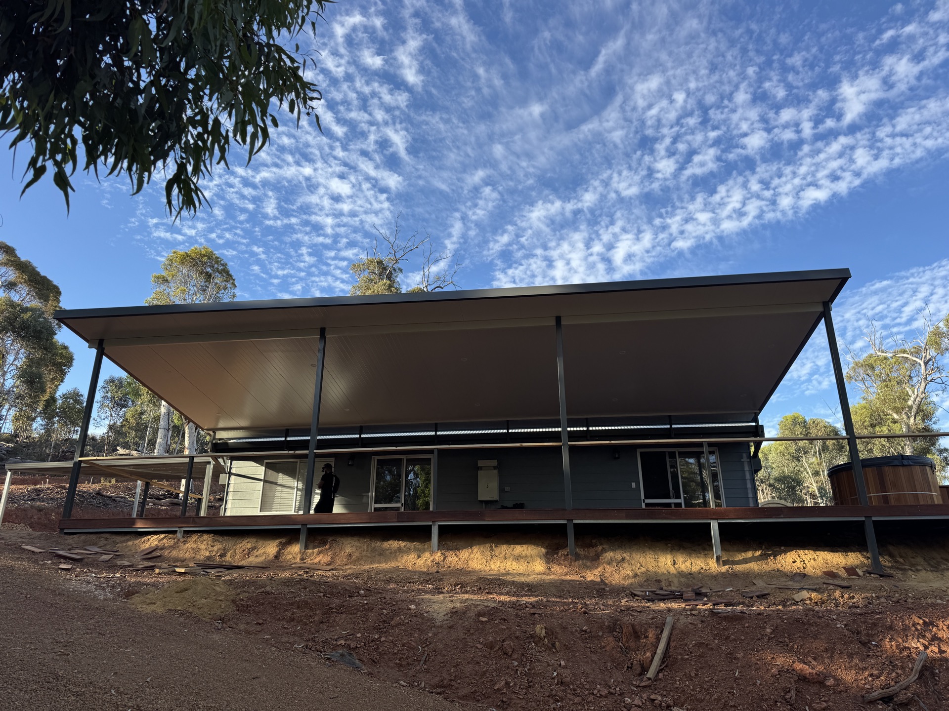 Flyover patio and merbau deck — bush property with blue sky